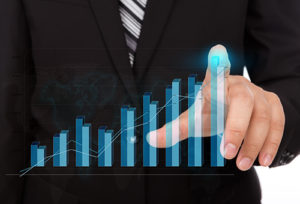 Executive reviewing asset register bar graph of building performance