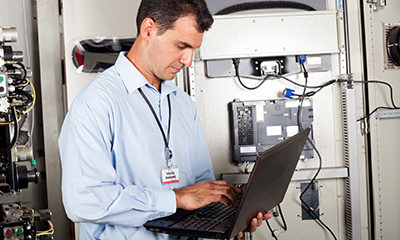 Technician performing programmed maintenance