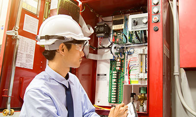 Fire Systems technician performing programmed maintenance