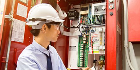 Fire Systems technician performing programmed maintenance