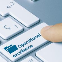 Commercial Property Landlord | Computer keyboard blue with the words "operational Excellence" for Facility Services