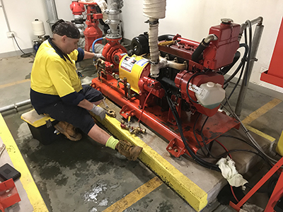 Employee working on Hydrant Diesel Pump cooling System for client based in Sydney