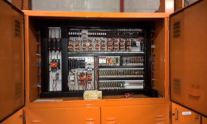 mechanical services switchboard serving the HVAC system. this image shows us the low level relay control in this olde style panel from the 1980's, in a rooft top plant room in chatswood in Sydney