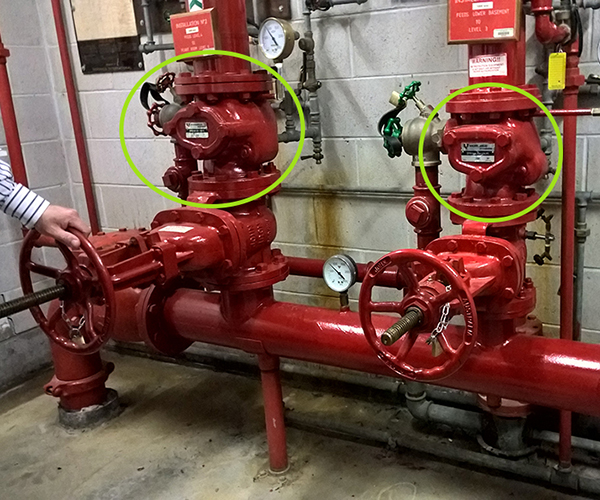sprinkler system alarm valves in a fire control room near the entry level of the Sydney based Commercial Building