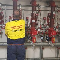 fire protection services technician inpsecting fire sprinkler system installation Sydney