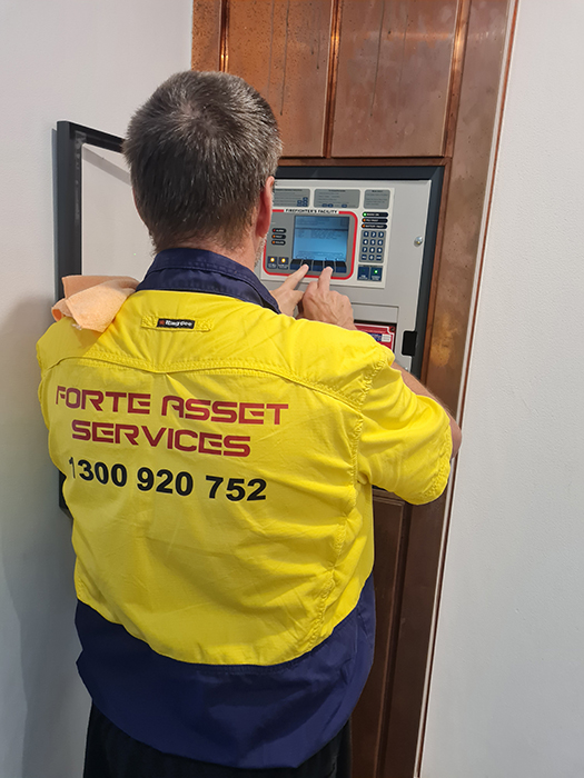 Forte Electrcian working on the installation of a ABB variable Speed Drive to servie the Cooling Tower fan in this residential Sydney Apartment complex